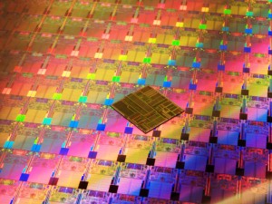 by 2008, the 1995 Pentium processor chip is many times larger than the chips on this processed silicon wafer. The smaller chips contain 407 million more transistors than the Pentium processor chip.